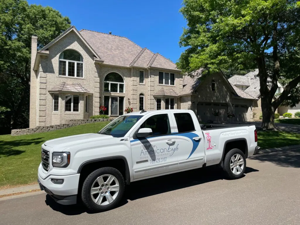 American Eagle Roofing and Home Improvement work truck outside of a customers house