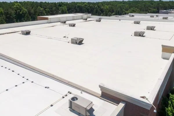 White commercial flat roof with rooftop HVAC equipment