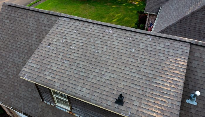Roof with hail damage and chalk markings from inspection